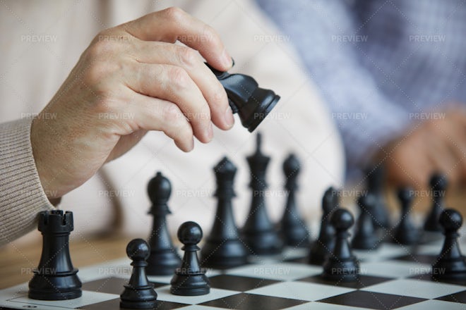 Children's Restraining Hand Thoughtfully Figure Before The Next Chess Move  Stock Photo, Picture and Royalty Free Image. Image 77247675.