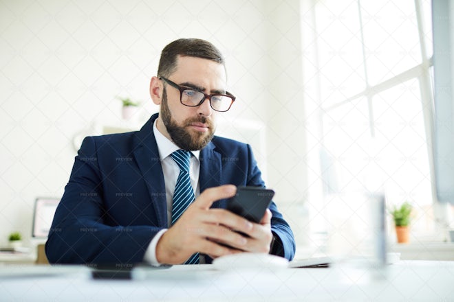 Business Manager Checking Phone In... - Stock Photos | Motion Array