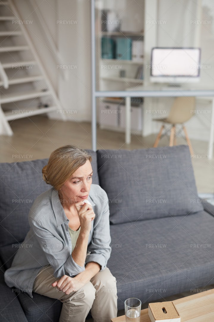 Pensive Mature Woman Crying At Home: Stock Photos