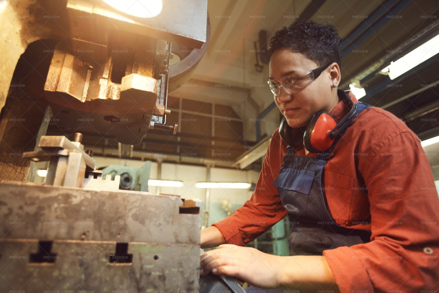 Mixed-Race Worker Using Heavy...: Stock Photos