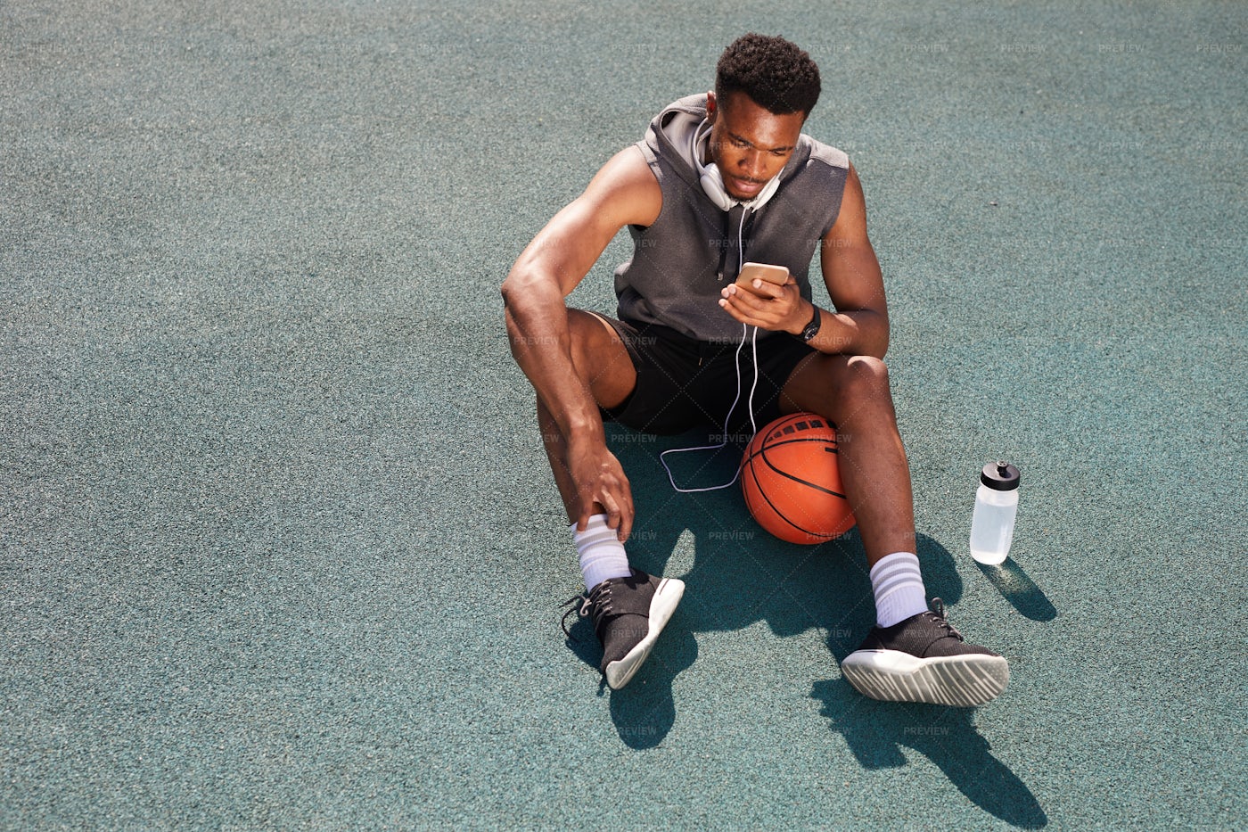 Basketball Player Rests: Stock Photos
