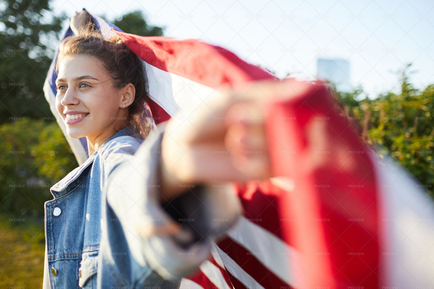 Pensive Female Patriot With US Flag: Stock Photos