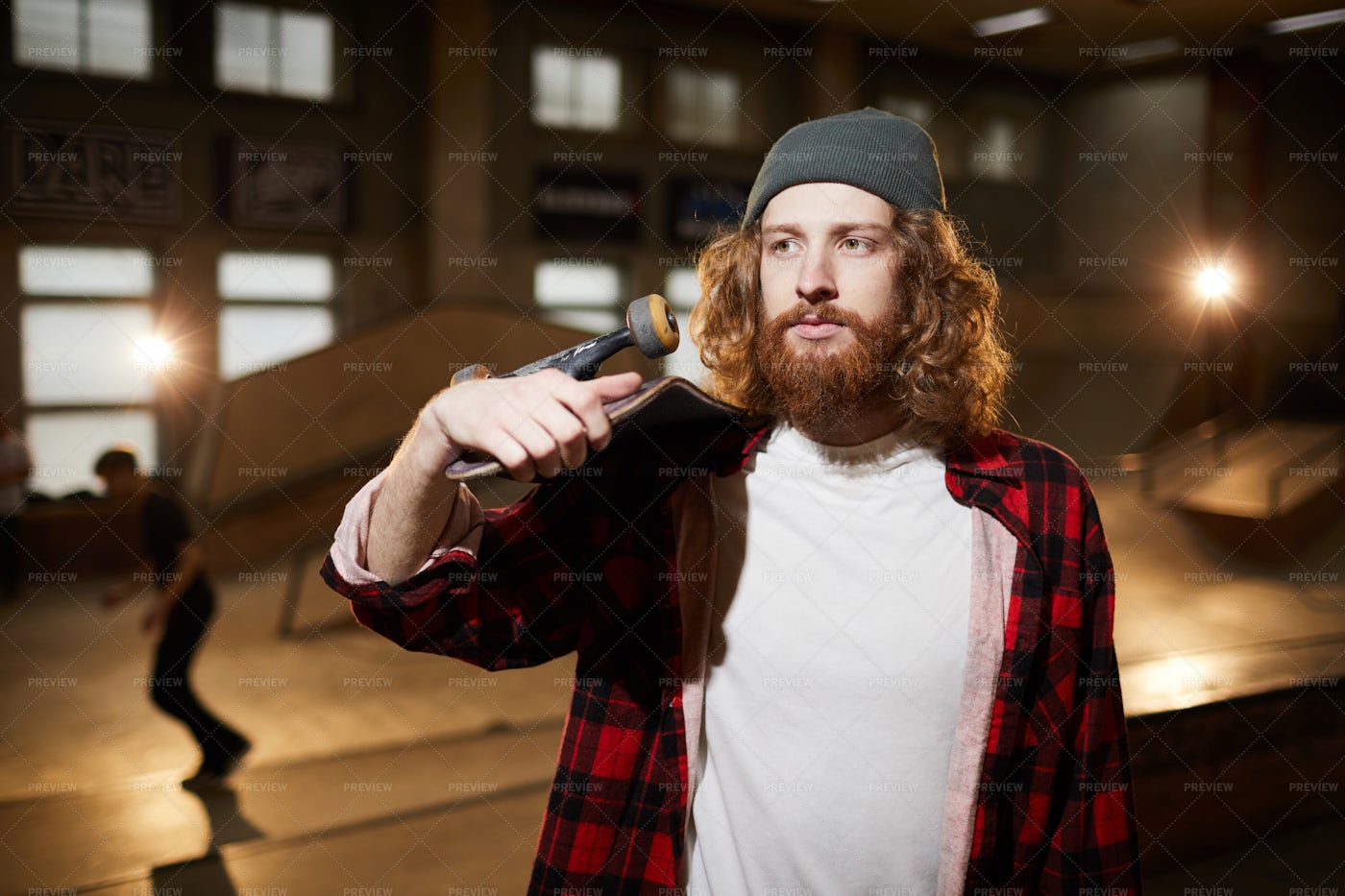 Hipster Man Holding Skateboard: Stock Photos