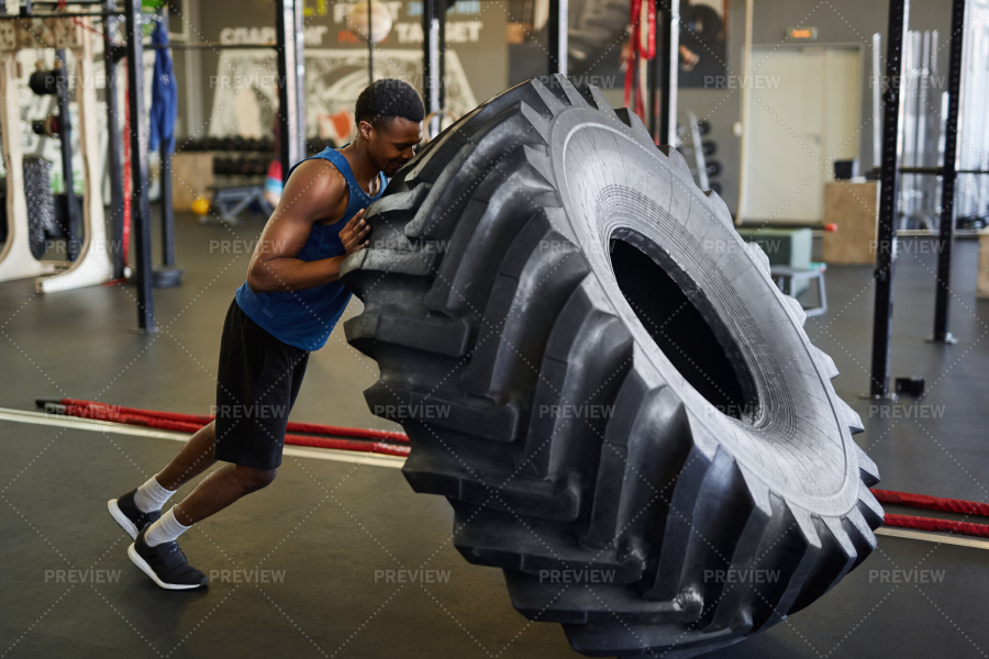 Strong Man Flipping Tire In Gym Stock Photos Motion Array