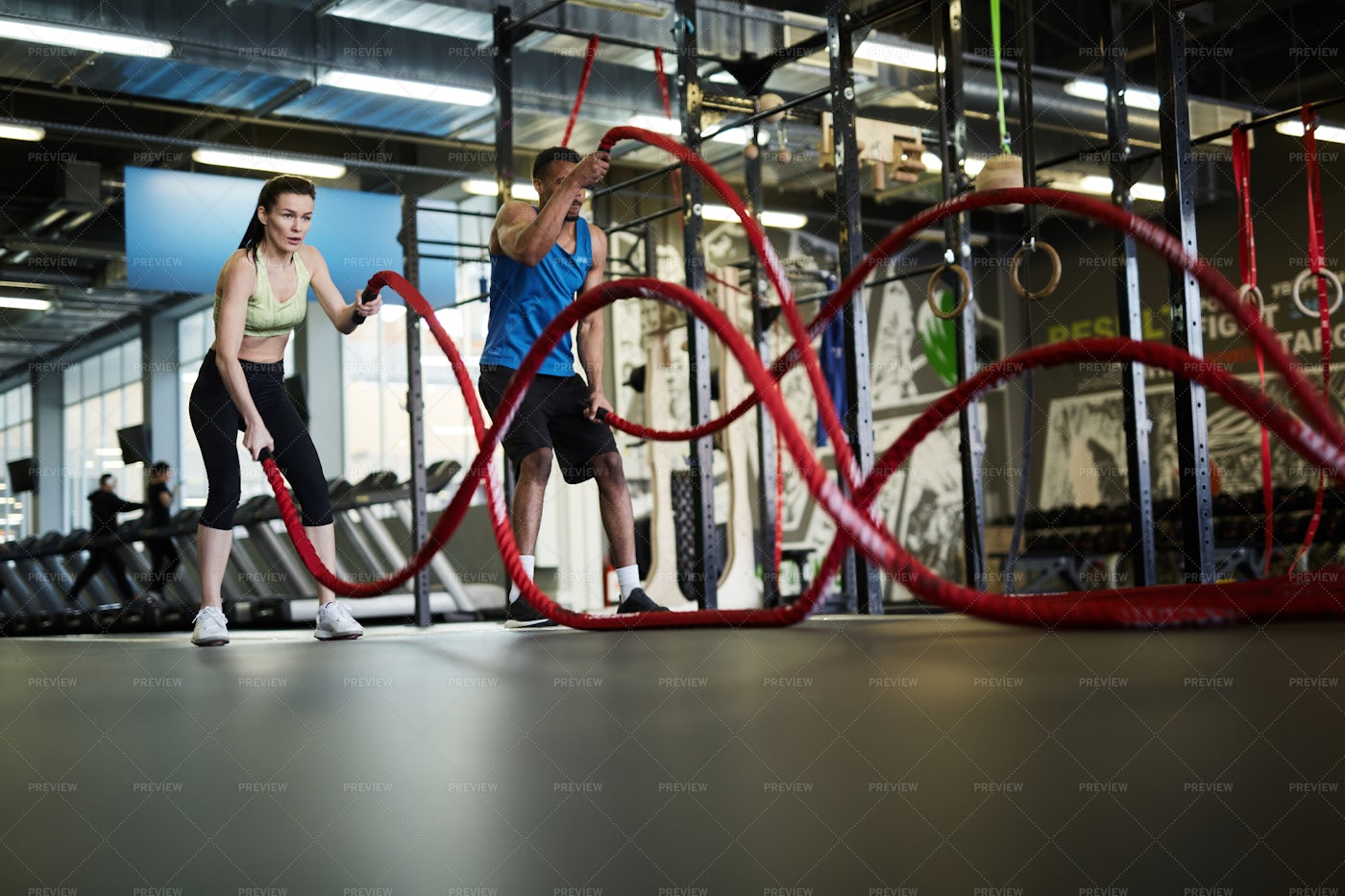 Couple Training With Battle Ropes: Stock Photos