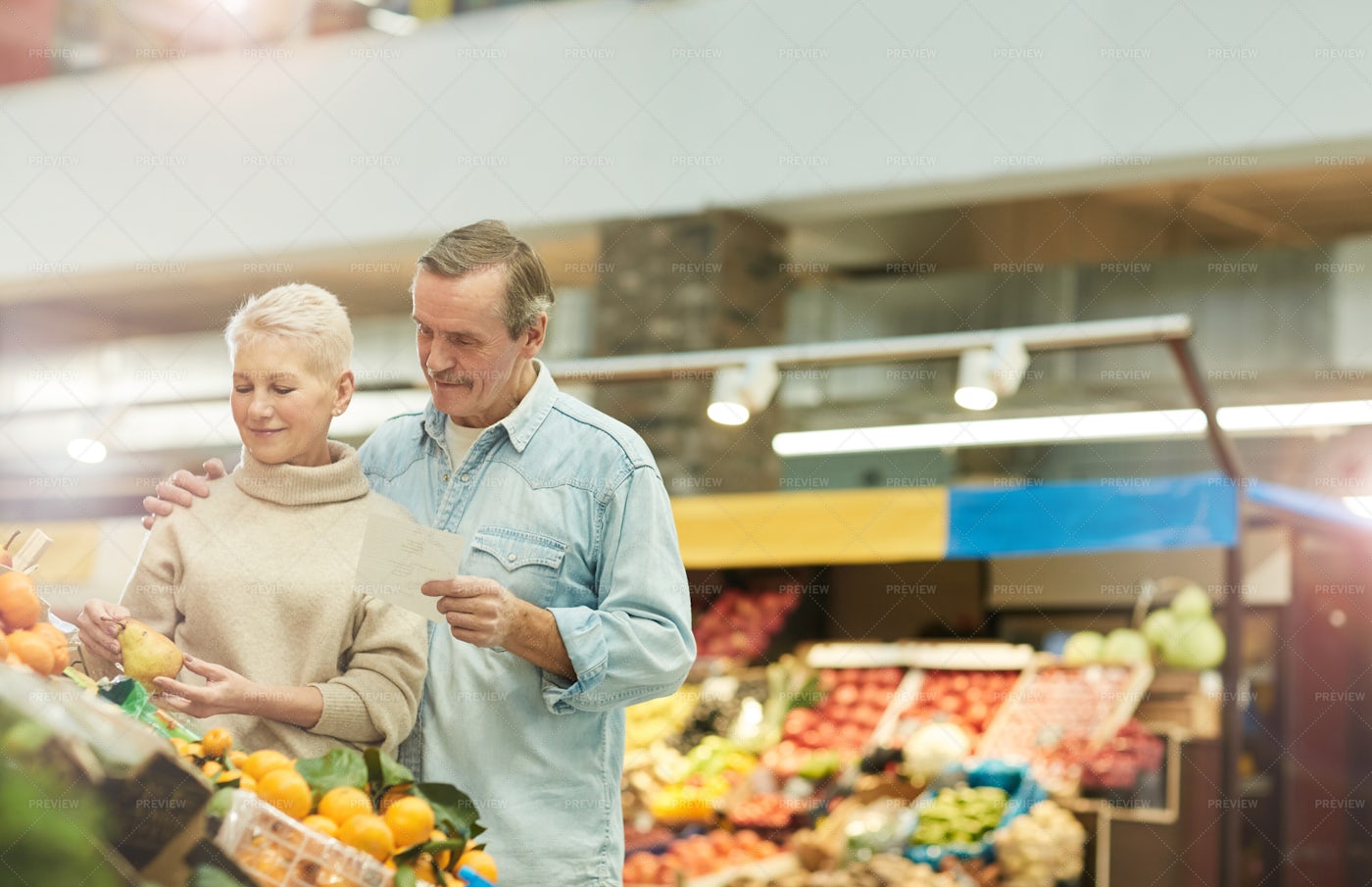 Senior Couple At Farmers Market: Stock Photos