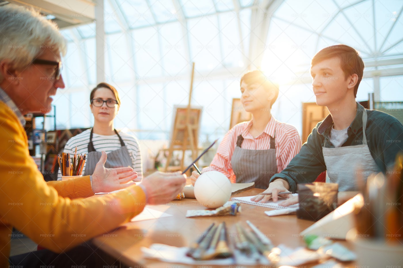 Art Students At Table: Stock Photos