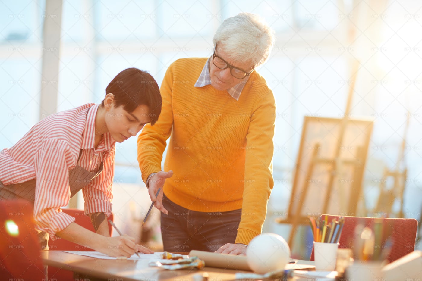 Art Teacher Working With Student: Stock Photos