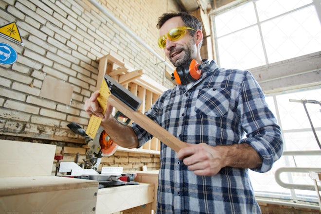 Cheerful Carpenter Using Triangle - Stock Photos | Motion Array