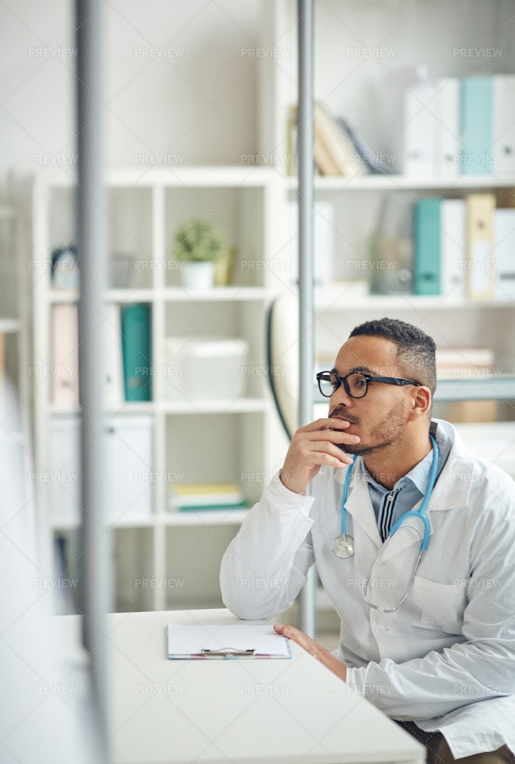 Doctor Using Computer At Workplace: Stock Photos
