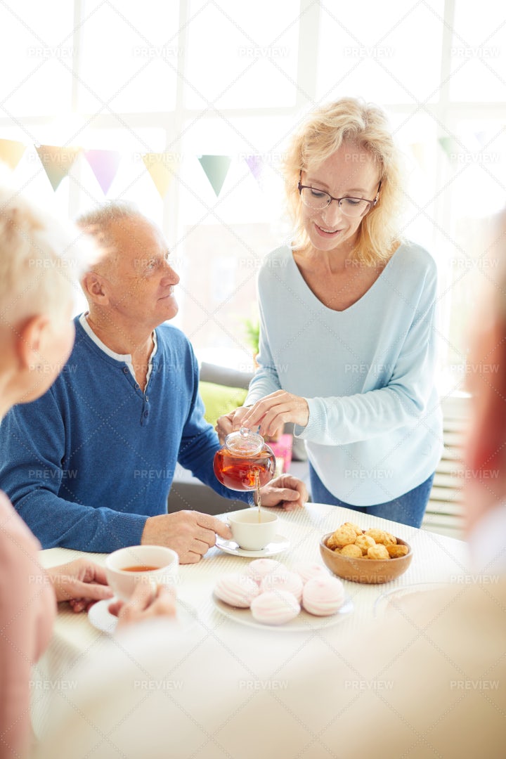 Pouring Tea For Guest: Stock Photos