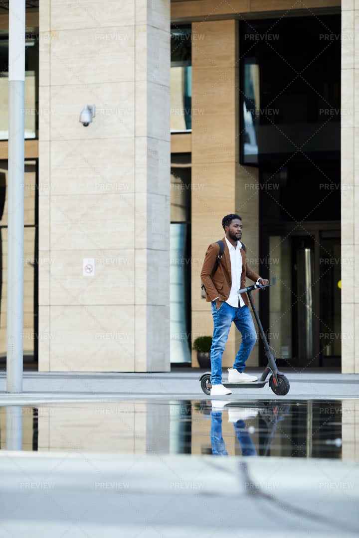 Man Riding A Scooter: Stock Photos