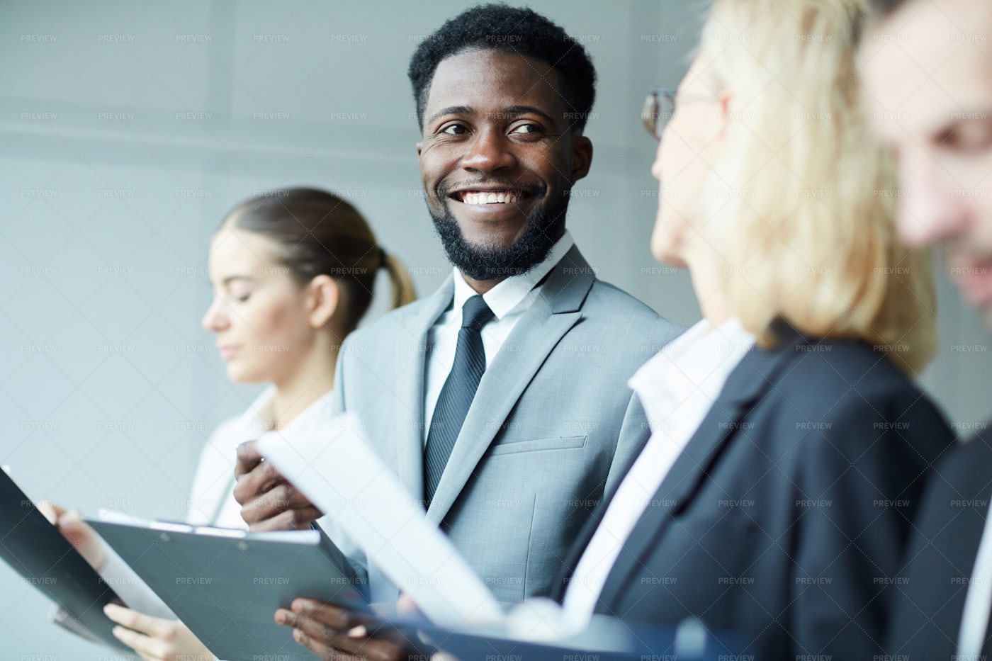 Talking While Making Notes: Stock Photos