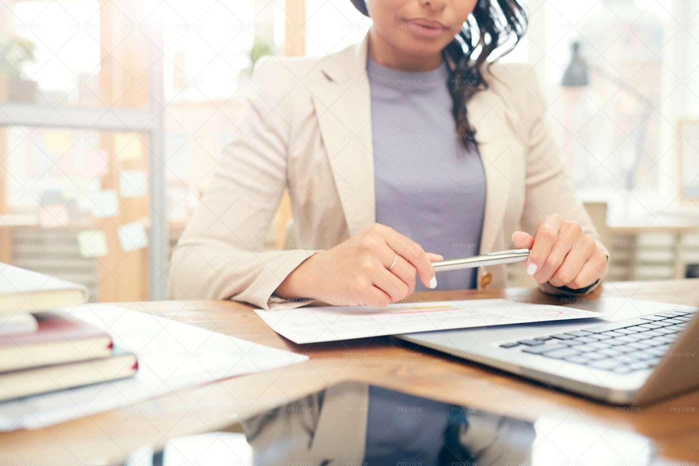 Businesswoman Reading Document At...: Stock Photos