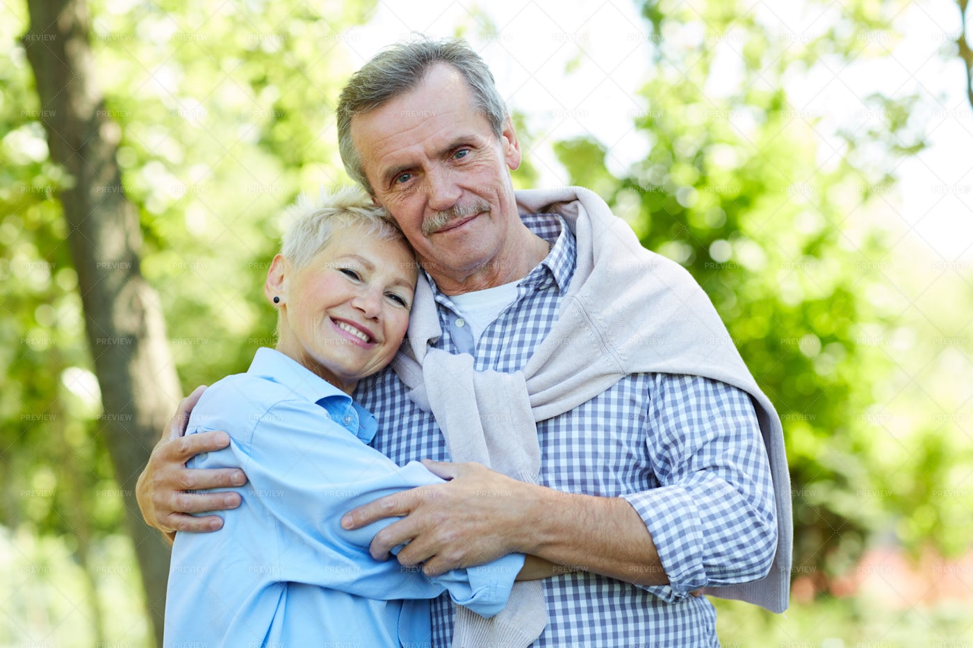 Happy Senior Couple Embracing In...: Stock Photos