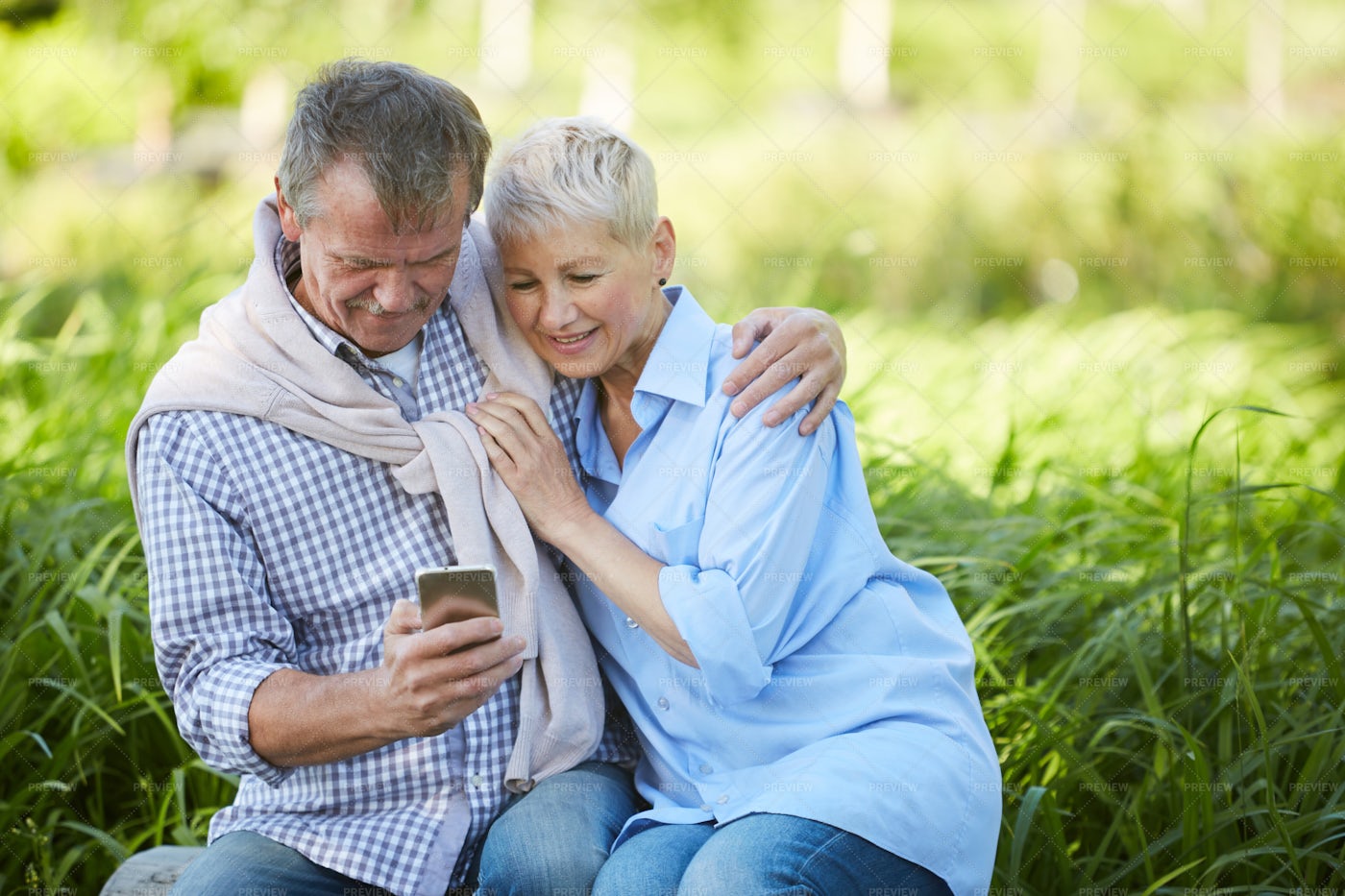 Senior Couple Using Smartphone...: Stock Photos