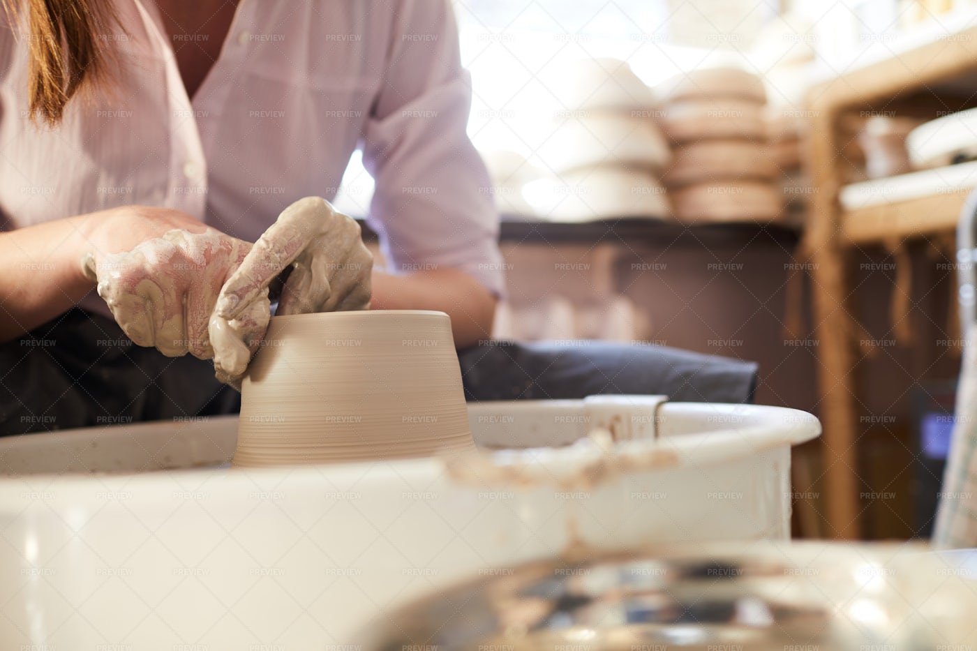 Woman Using Potters Wheel Closeup: Stock Photos