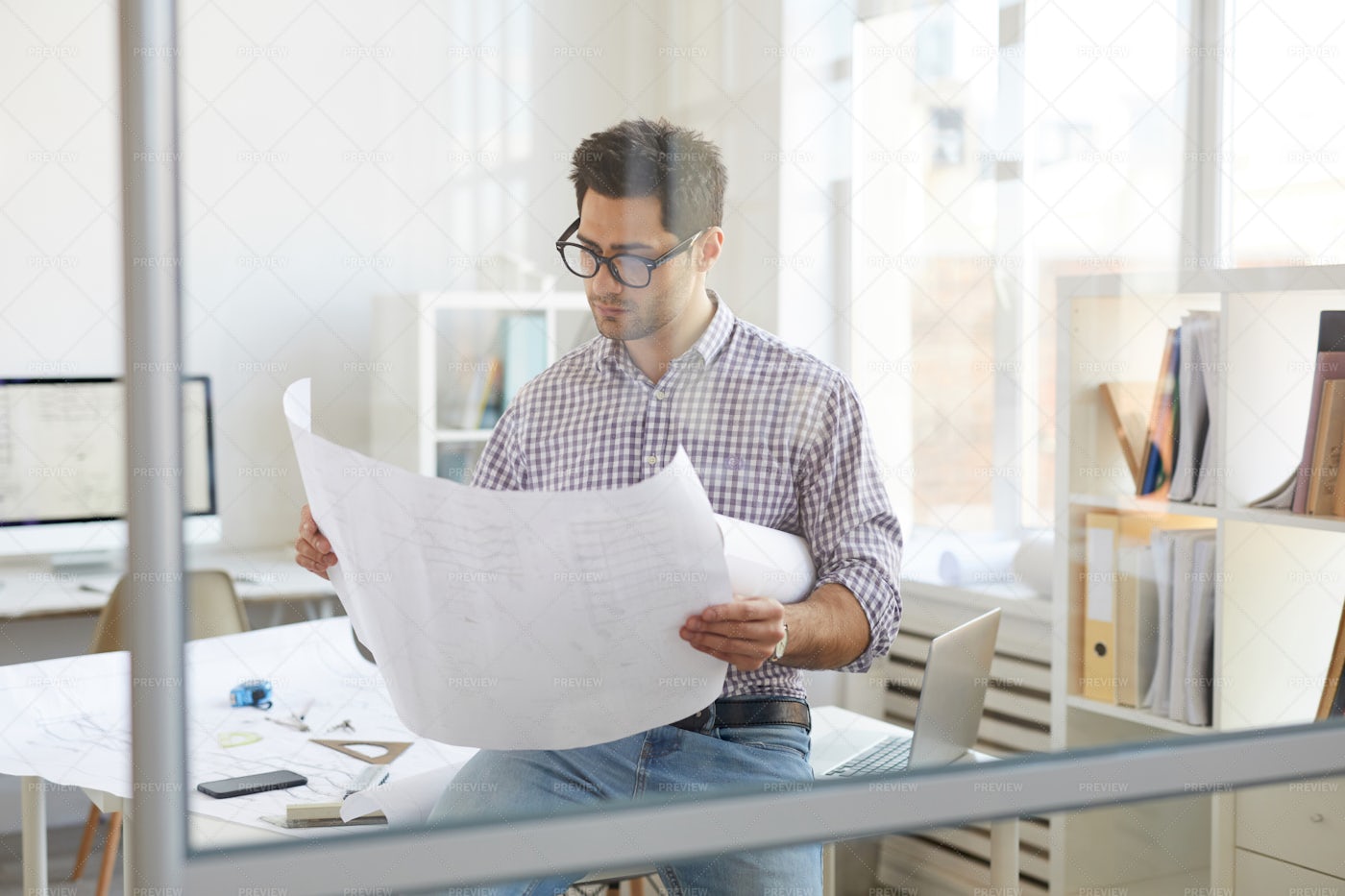 Engineer At Workplace Behind Glass: Stock Photos