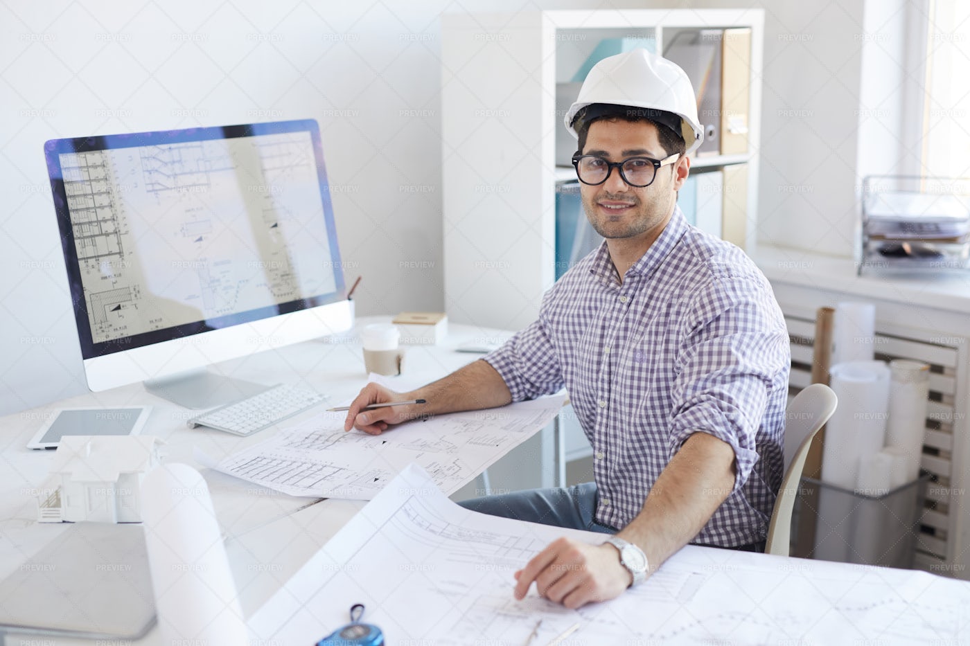 Smiling Engineer Posing At...: Stock Photos