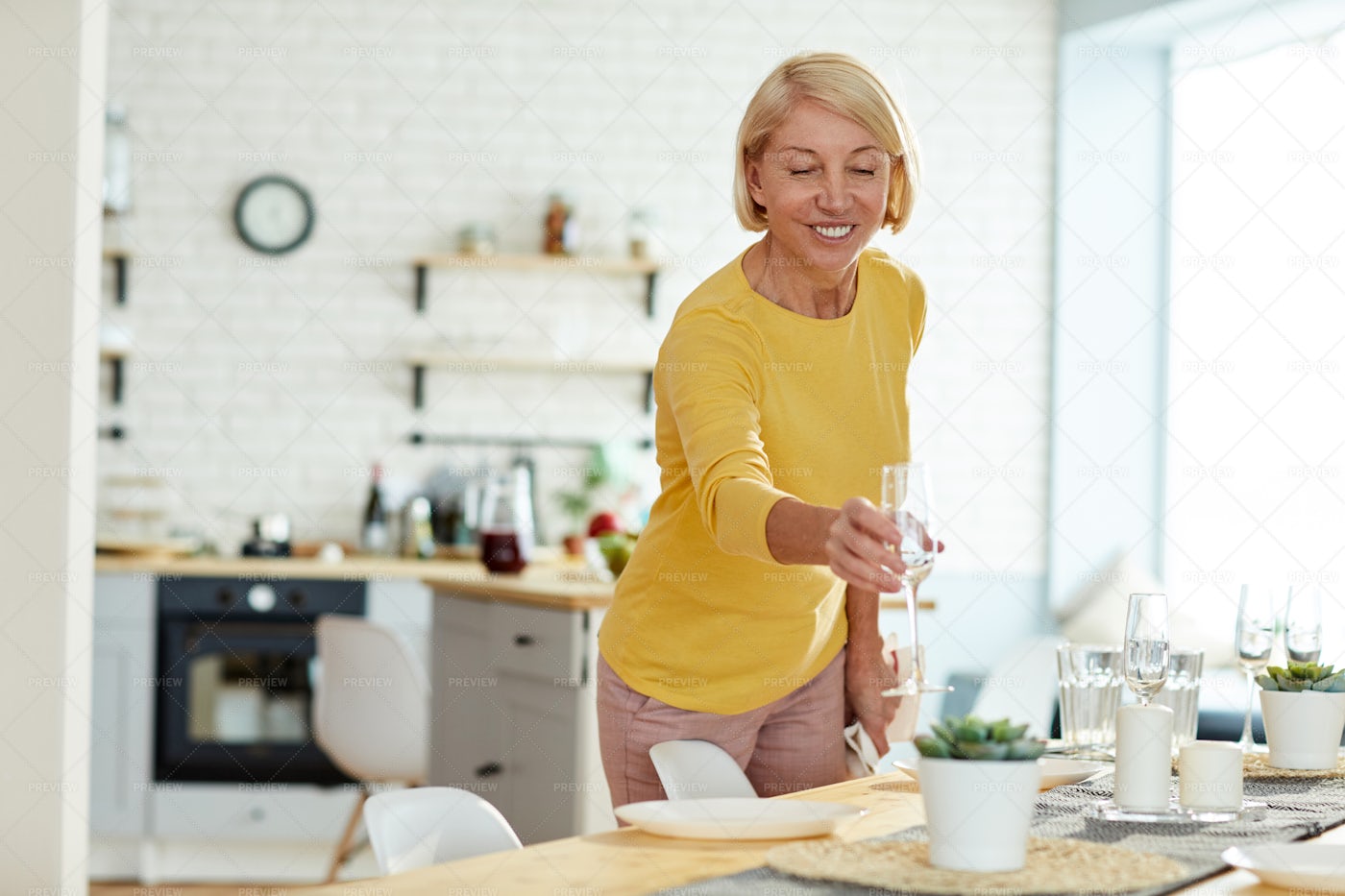 Smiling Woman Putting Flute On...: Stock Photos