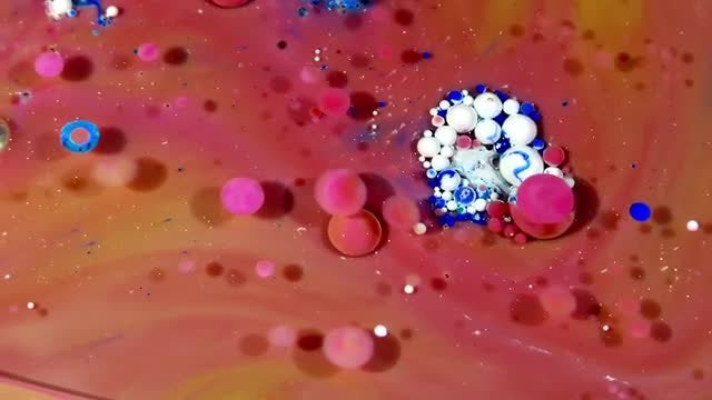 Colorful Ink Spheres On Oil 20: Stock Video