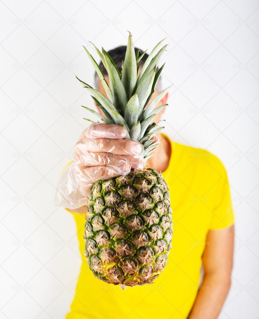 Holding A Pineapple: Stock Photos