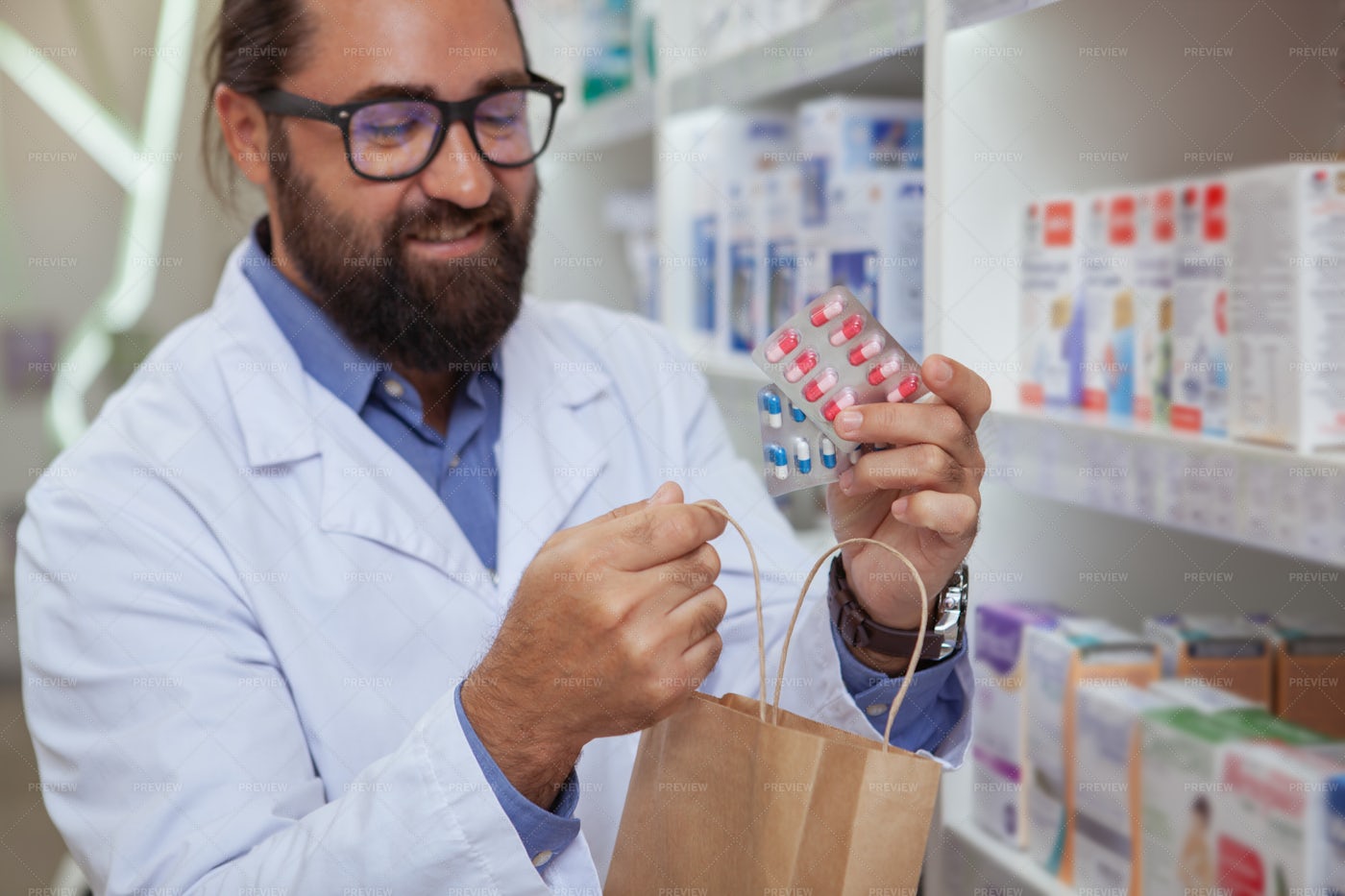 Pharmacist Selling Medication: Stock Photos