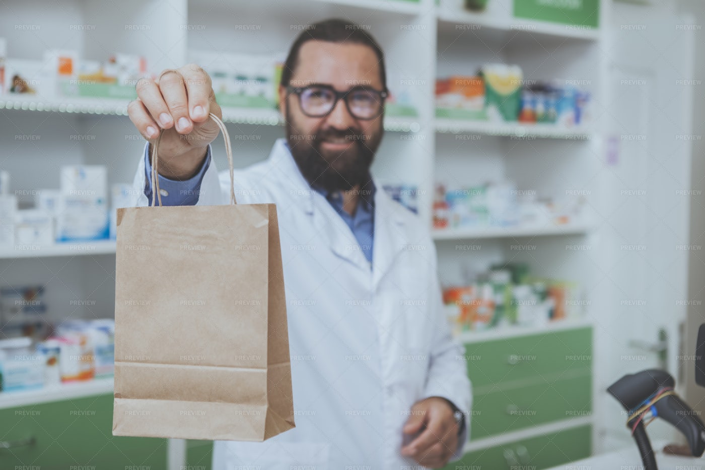 Pharmacist Handing Over Purchases: Stock Photos