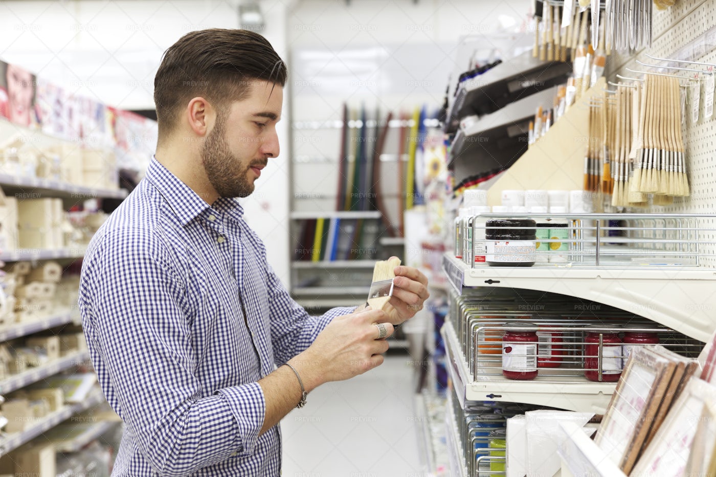 Buying Paint And Brushes: Stock Photos
