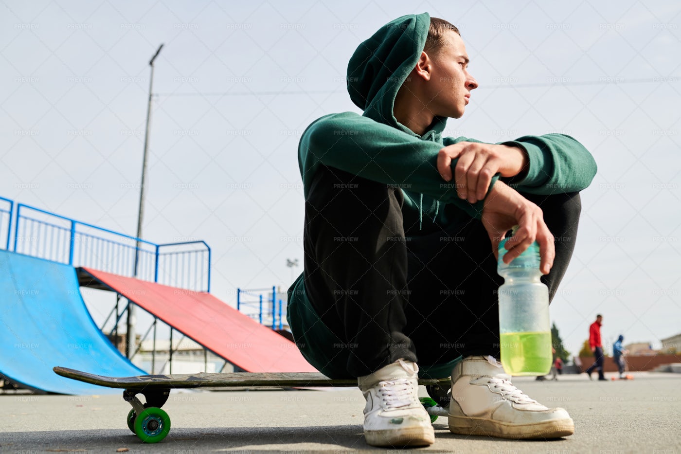 Young Man Sitting On Skate: Stock Photos