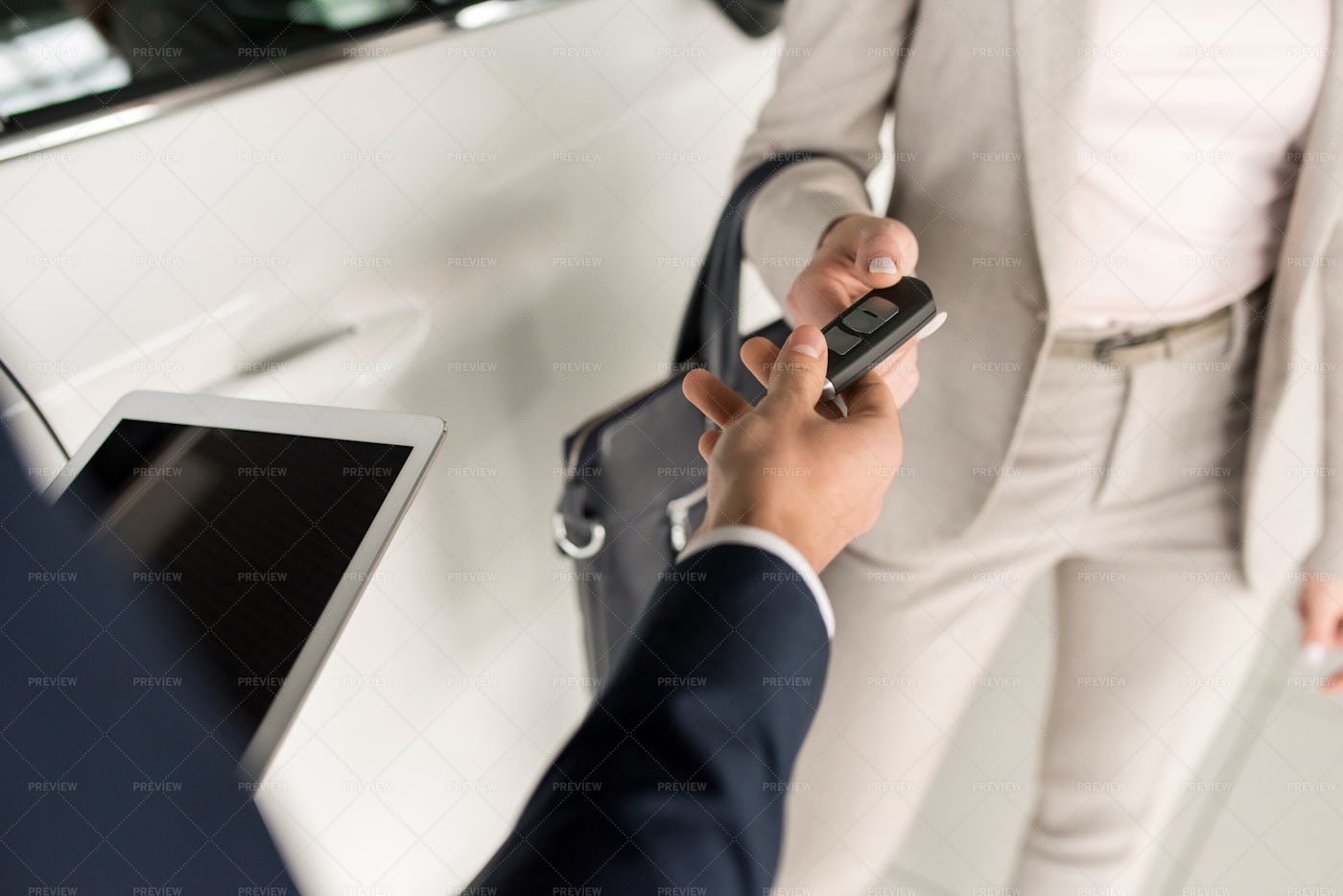 Salesman Giving Car Keys To Client: Stock Photos