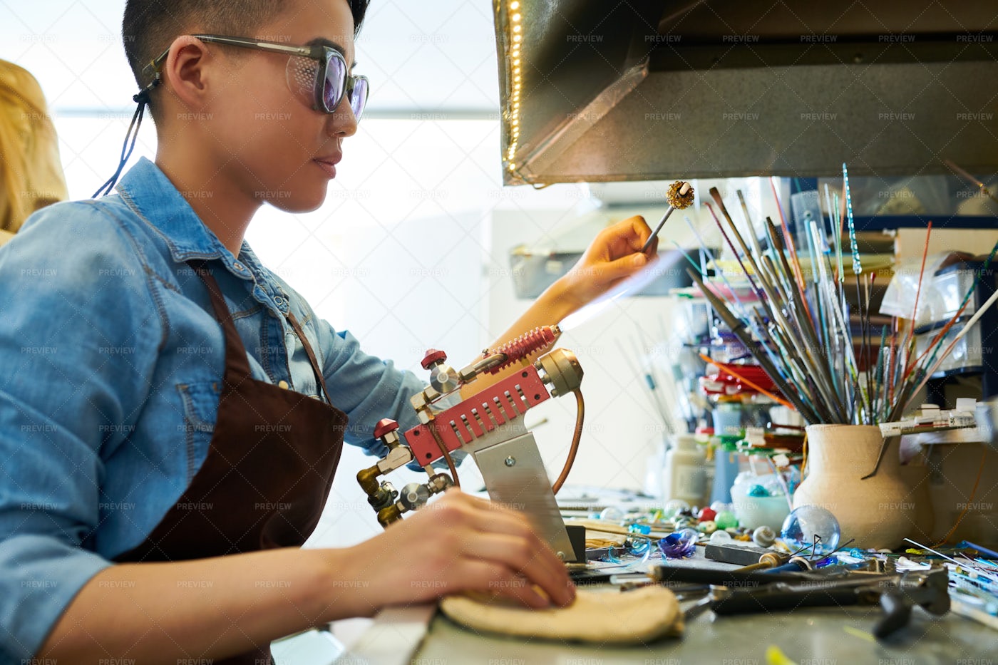 Asian Artist Shaping Glass In Flame: Stock Photos
