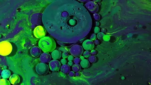 Colorful Ink Spheres On Oil 31: Stock Video