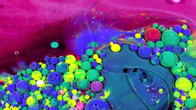 Colorful Ink Spheres On Oil 35: Stock Video