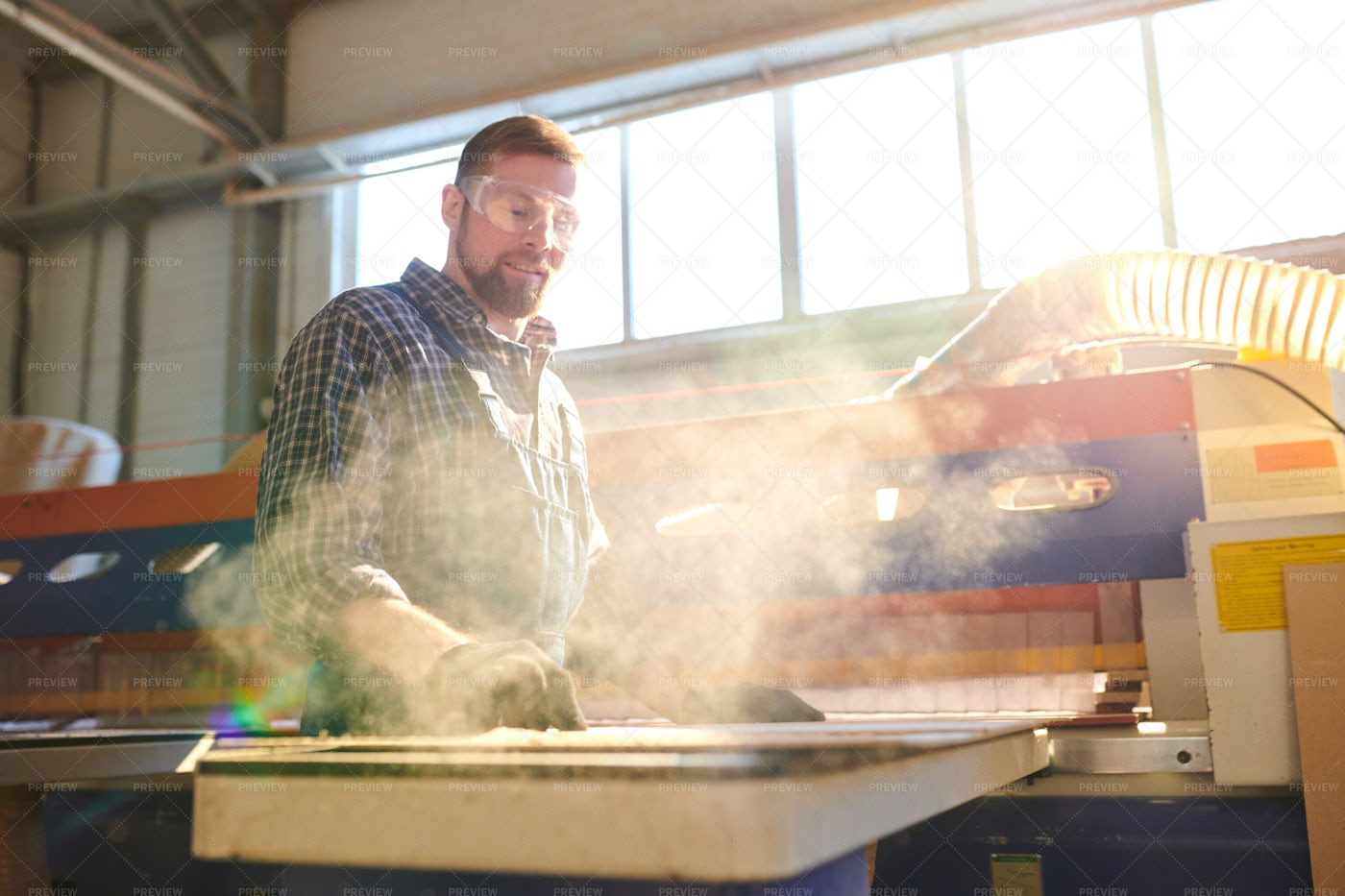 Bearded Employee Working In Dusty...: Stock Photos