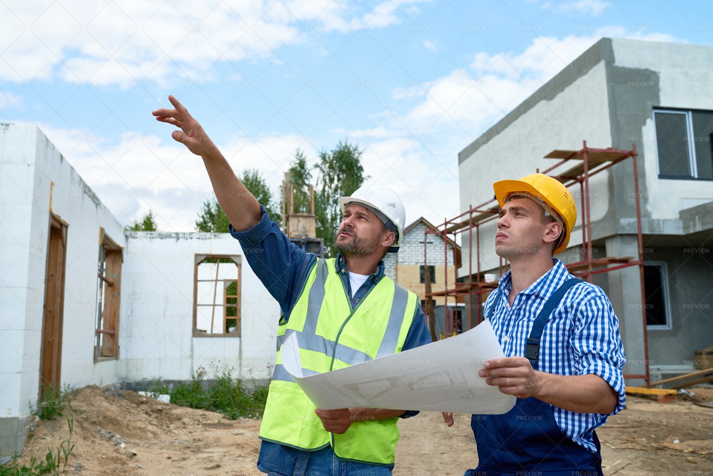 Foreman Overseeing Building...: Stock Photos