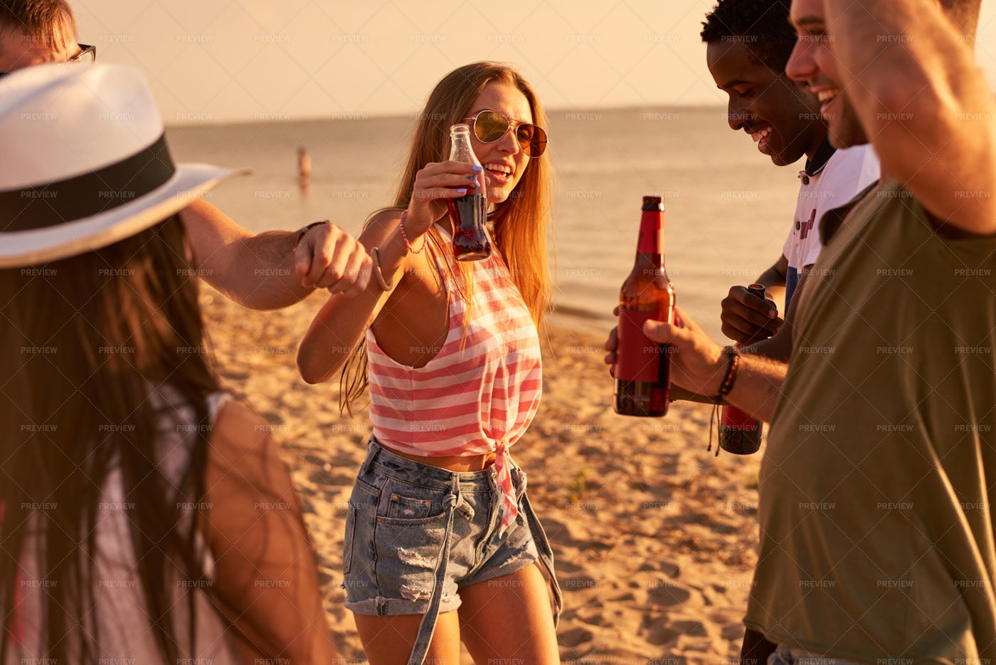 Carefree Friends Drinking Beer At...: Stock Photos