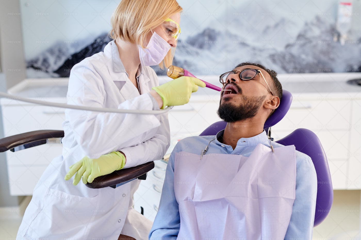 Undergoing Teeth Polishing: Stock Photos