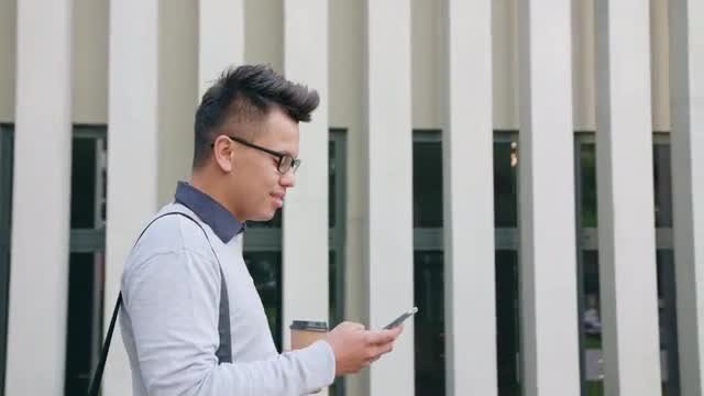 Young Man Using Phone: Stock Video
