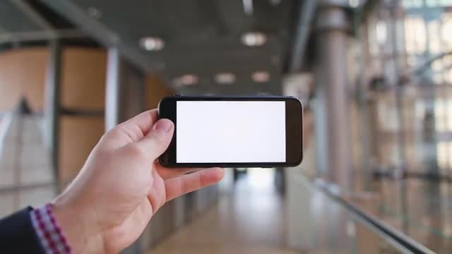 A Hand Holding A Phone: Stock Video