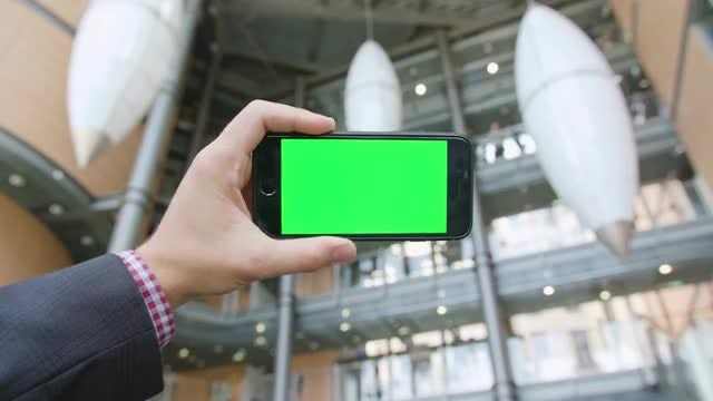 Hand Holding Phone With Green Screen: Stock Video