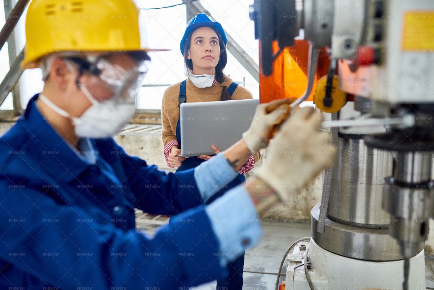 Female Engineer Working At Factory: Stock Photos