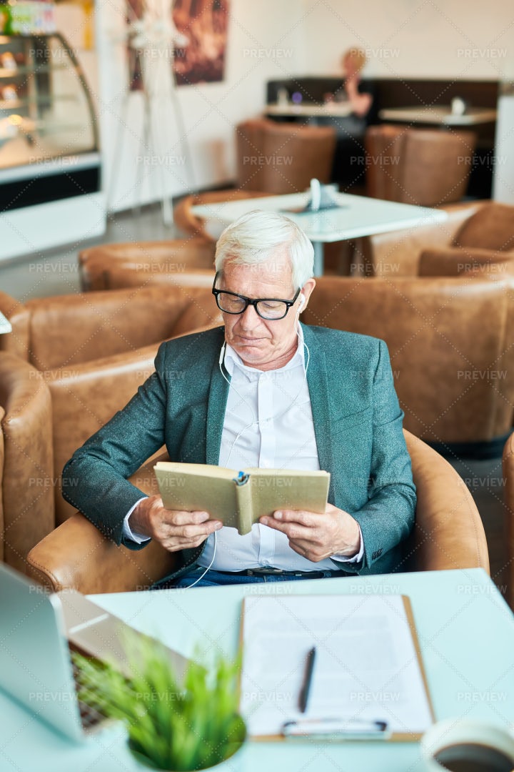 Senior Businessman Reading Book: Stock Photos