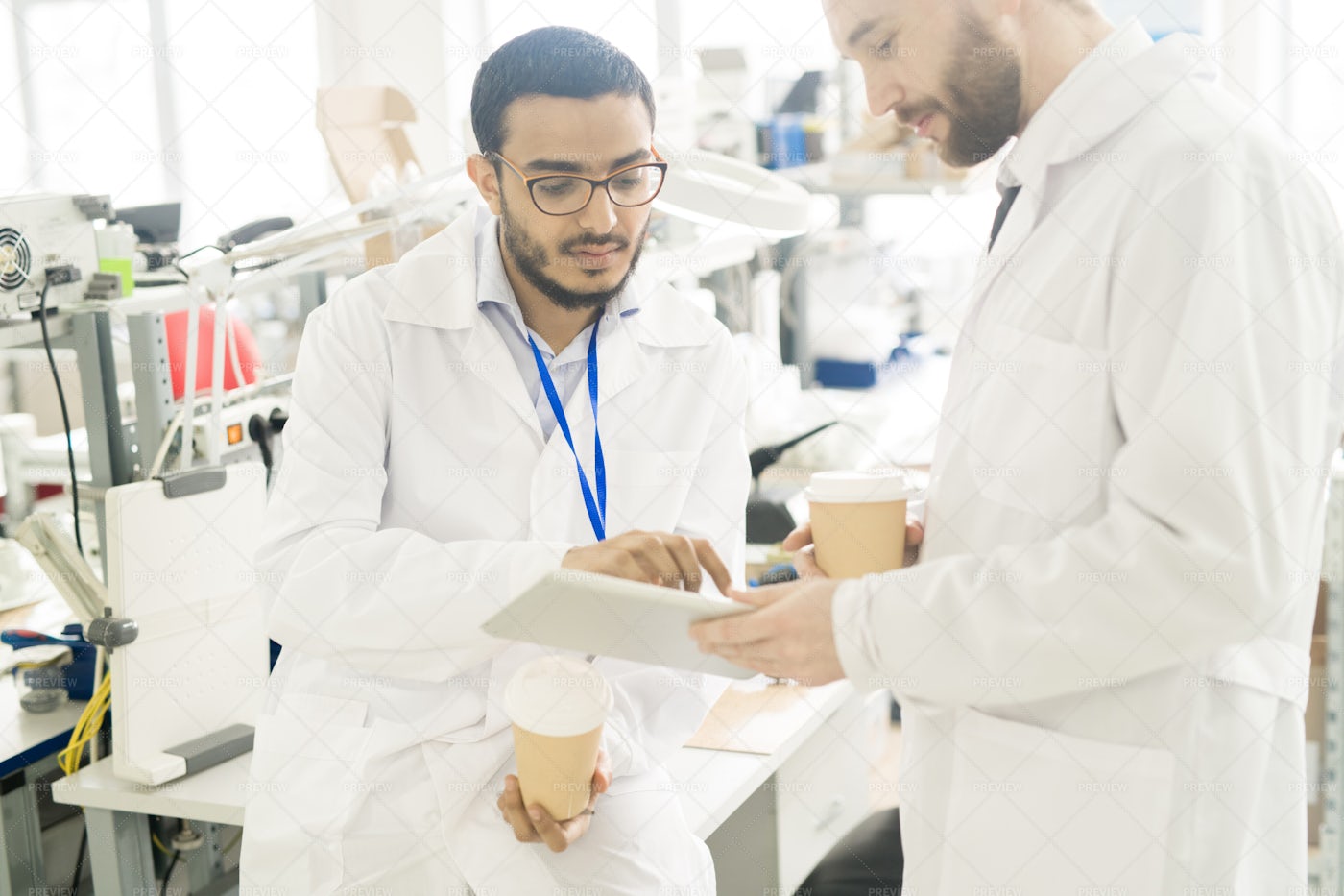 Serious Engineers Analyzing Data On...: Stock Photos