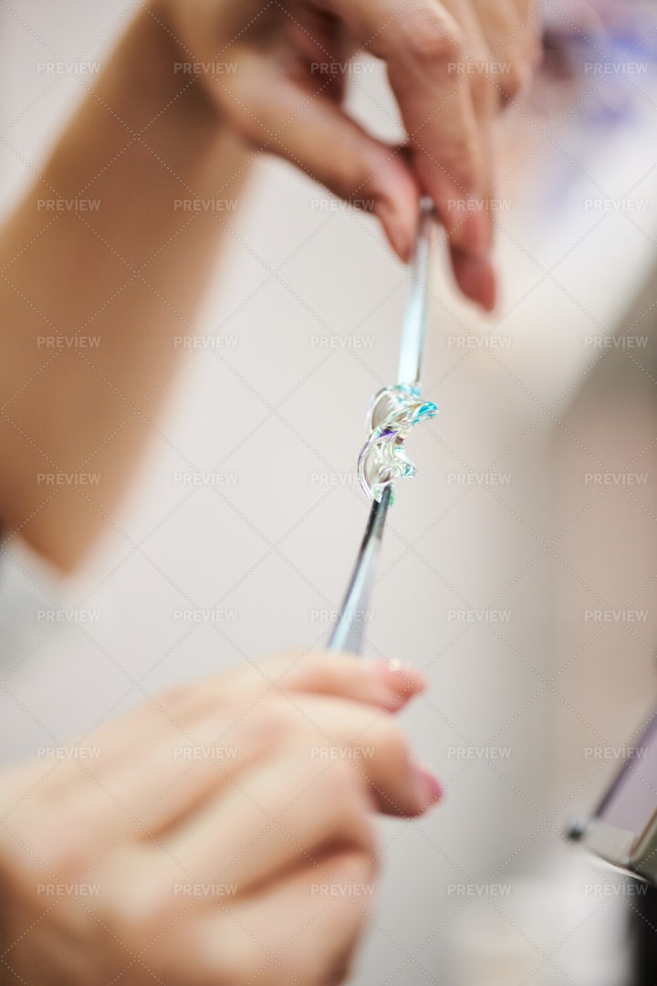 Woman Shaping Glass In Studio: Stock Photos