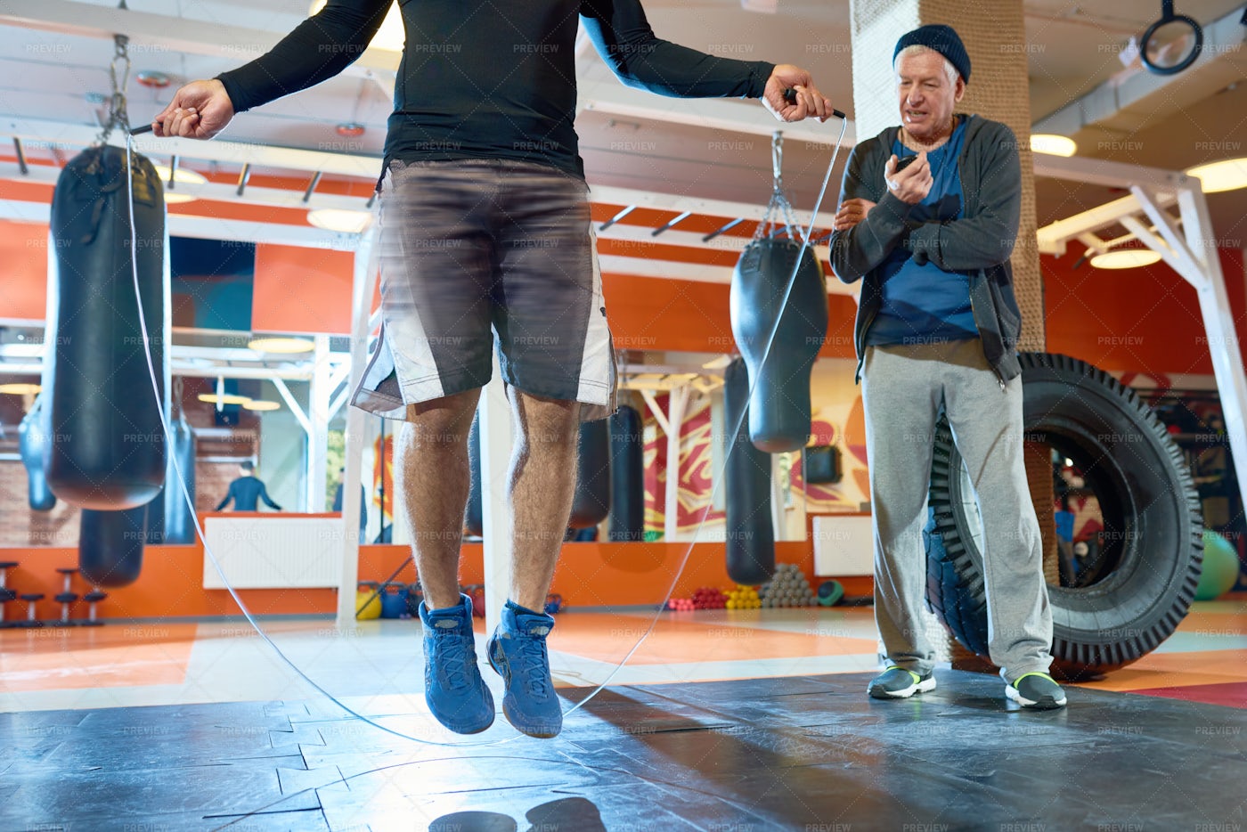Coach Training Boxer In Gym: Stock Photos