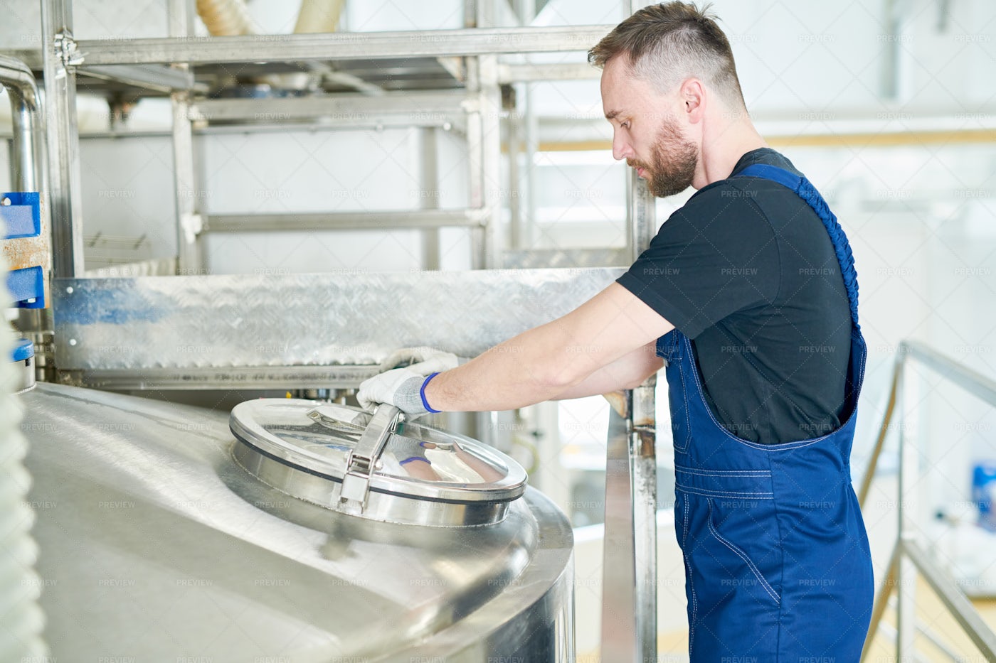 Bearded Worker Controlling...: Stock Photos