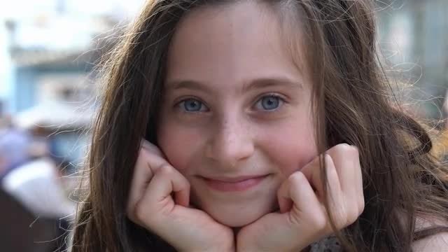 Girl Looks Into Camera And Smiles: Stock Video