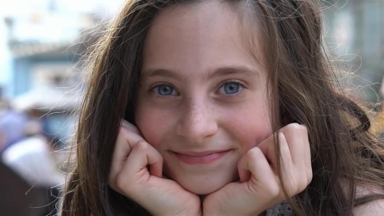 Girl Looks Into Camera And Smiles: Stock Video