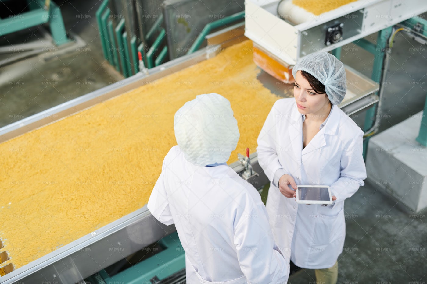 Two Workers At Production Line: Stock Photos